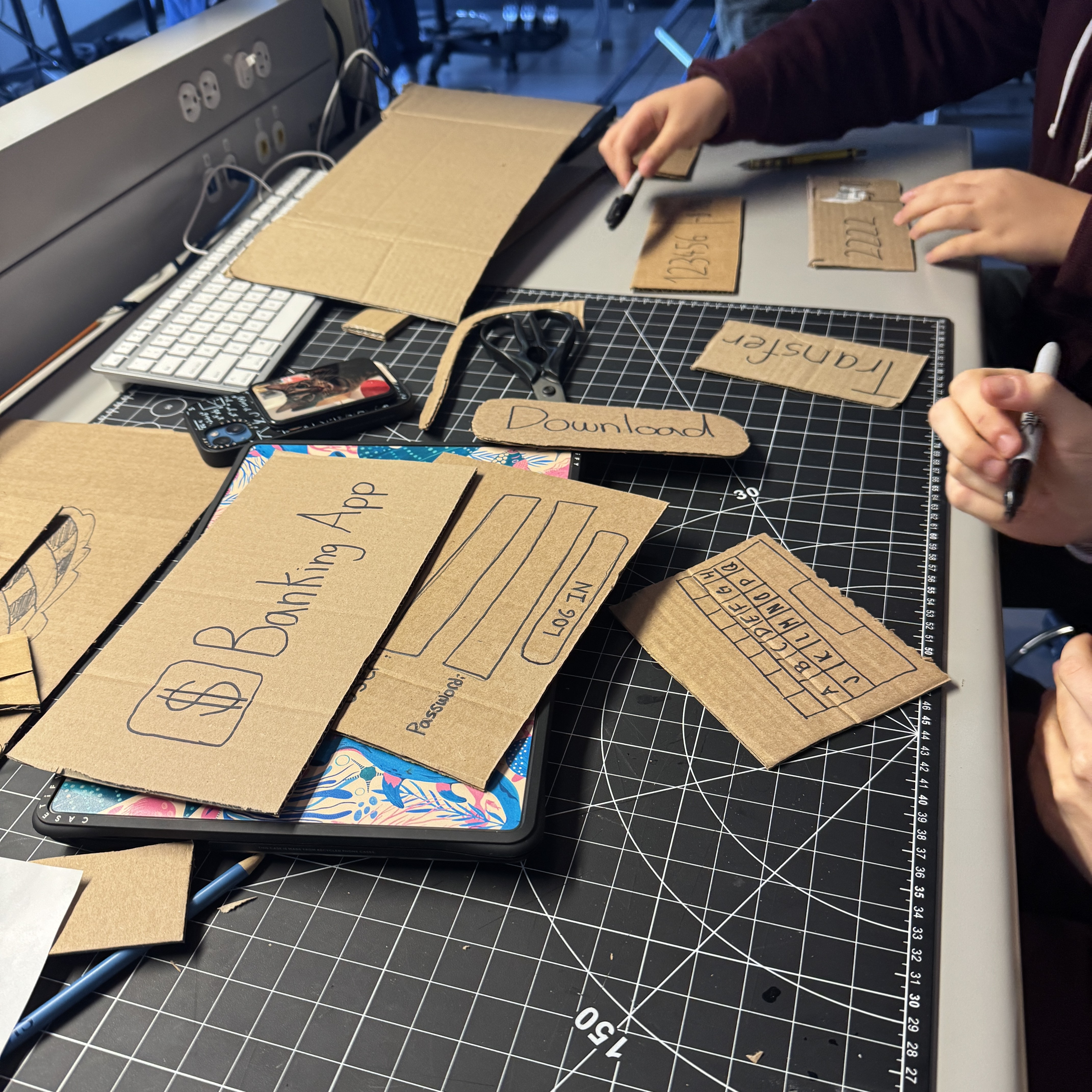 Challenge: Onboard a new user to a complex service app (e.g., for banking or public transit).<p></p> 


<p></p>Roles: 
Livia: User (frustrated/skeptical)
Darian: Smartphone Interface (a person who provides “screen” responses)
Marley: App Feature 1
Rianna: App Feature 2
Rayne: Observer

<p></p>Task: 
Downloading and opening the app
Navigating initial screens
Completing a core task (moving money into another account)
Receiving error messages

<p></p>Planning:
Make giant phone screen
Download button
Login feature
Move money feature
